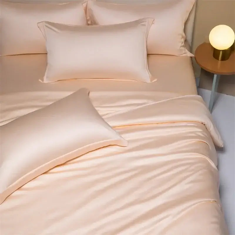 Cream-colored satin bedding set with smooth glossy finish in peach satin cooling cotton solid design for bedroom use