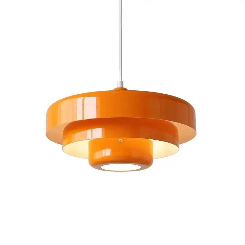Vibrant orange glossy finished tiered pendant lighting with concentric circular rings bauhaus style retro pendant lamp