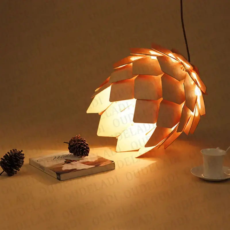 Warm-toned pinecone wooden pendant lights with orange and gold geometric leaf design for dining room decorbites handmade smart