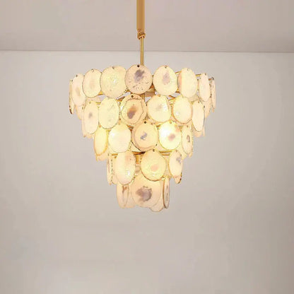 A pink agate designer led chandelier with translucent circular slices and polished gold frame for dining room decorbites agate designer