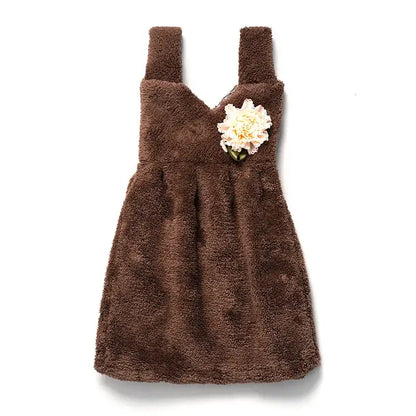 A cozy brown plush kids cute dress with cream floral embellishment featured on a decorbites hand towel