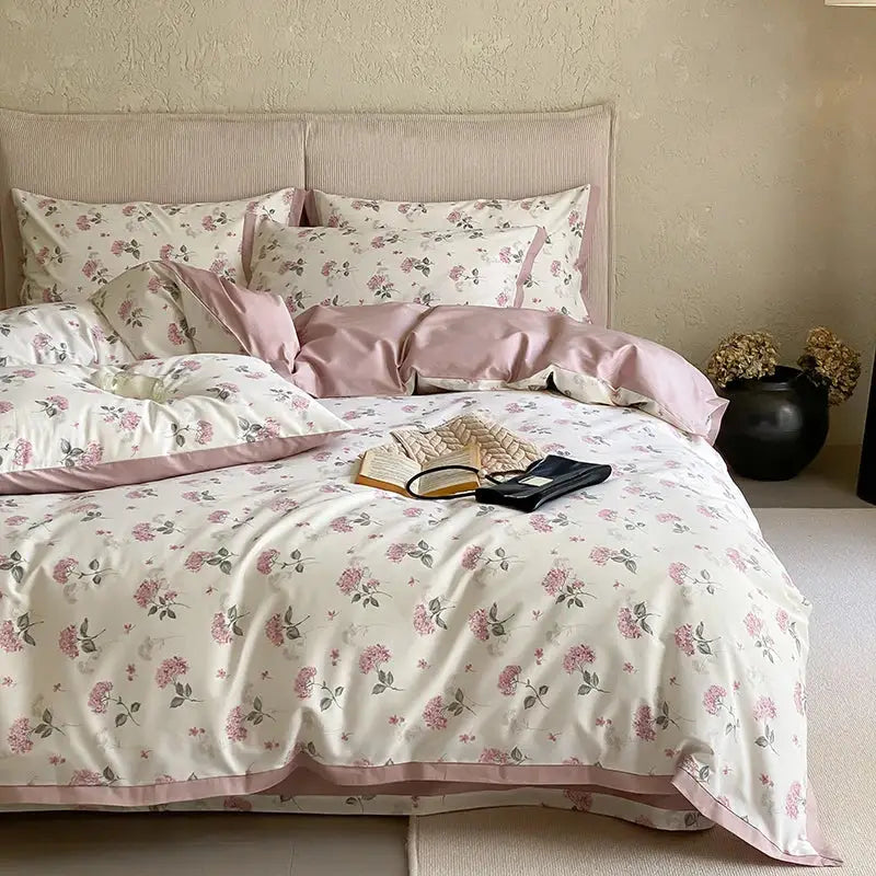 Pink and cream floral egyptian cotton print bedding set with satin trim for bedroom use