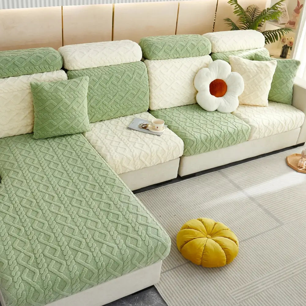 Green and cream quilted sofa cover with a textured braided pattern for living room seat protection