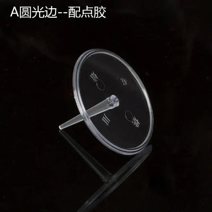 Clear acrylic circular cake stand with central stem and engraved markings for pink and purple doll cake stands decoration