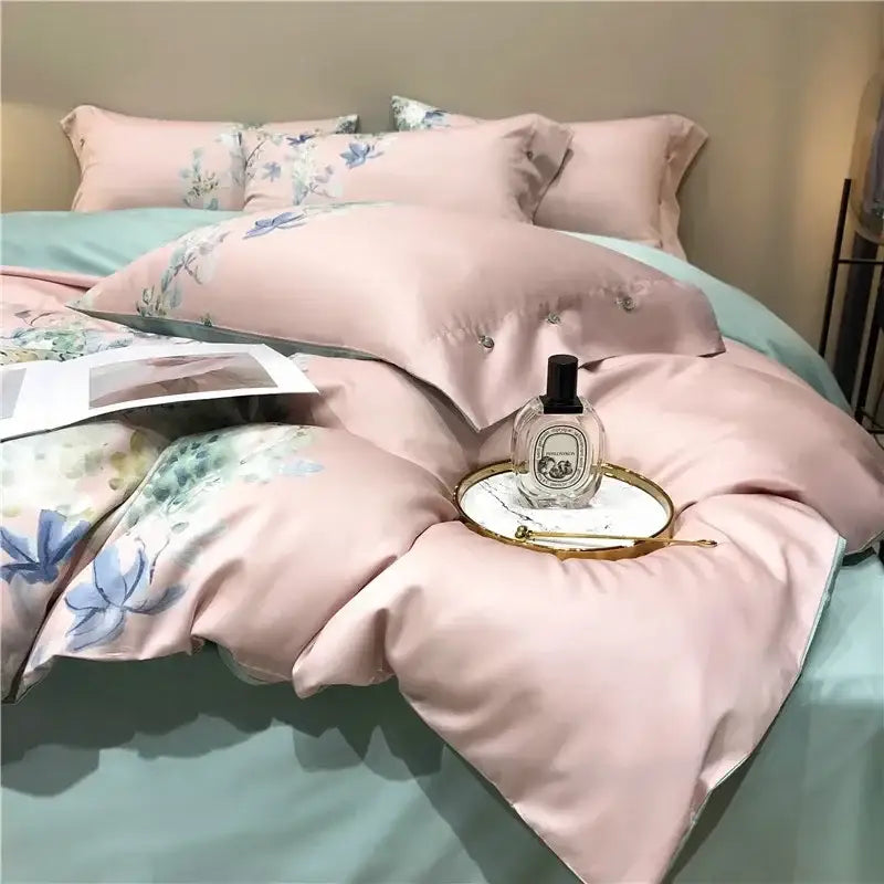 Pink and teal floral egyptian cotton bedding set featuring a delicate satin duvet with subtle button pillowcase details