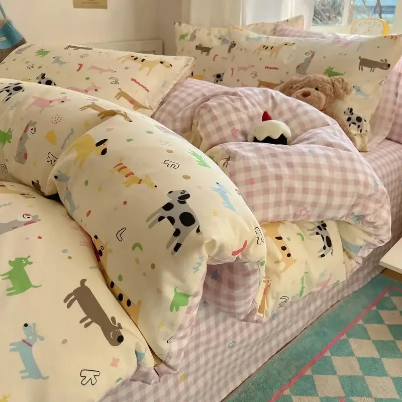 Cream-colored cartoon printed cotton quilt cover with playful dogs and matching pink gingham decorbites cartoon printed pillows