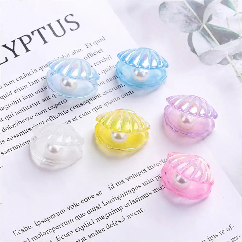Pink and white mermaid colorful plated seashells with translucent shell-shaped charms and embedded pearls decorbites colorful plated