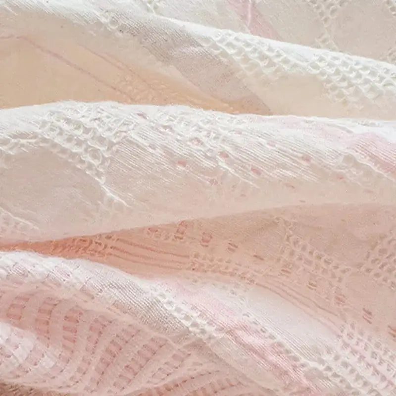 Delicate white lace fabric with pink accents and woven patterns on pink and white striped cotton jacquard bedding set decorbites cotton jacquard