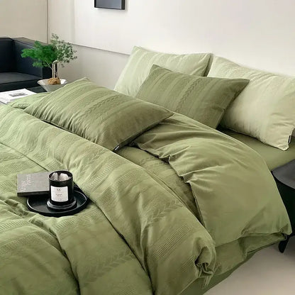 Olive green textured bedding set with woven pattern and matching pillows from decorbites cotton jacquard bedding collection