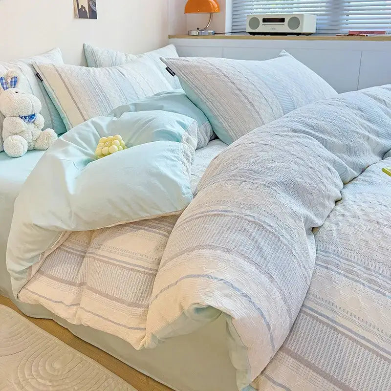 Soft pastel blue and white striped quilted duvet set with cozy textured fabric in decorbites cotton jacquard bedding