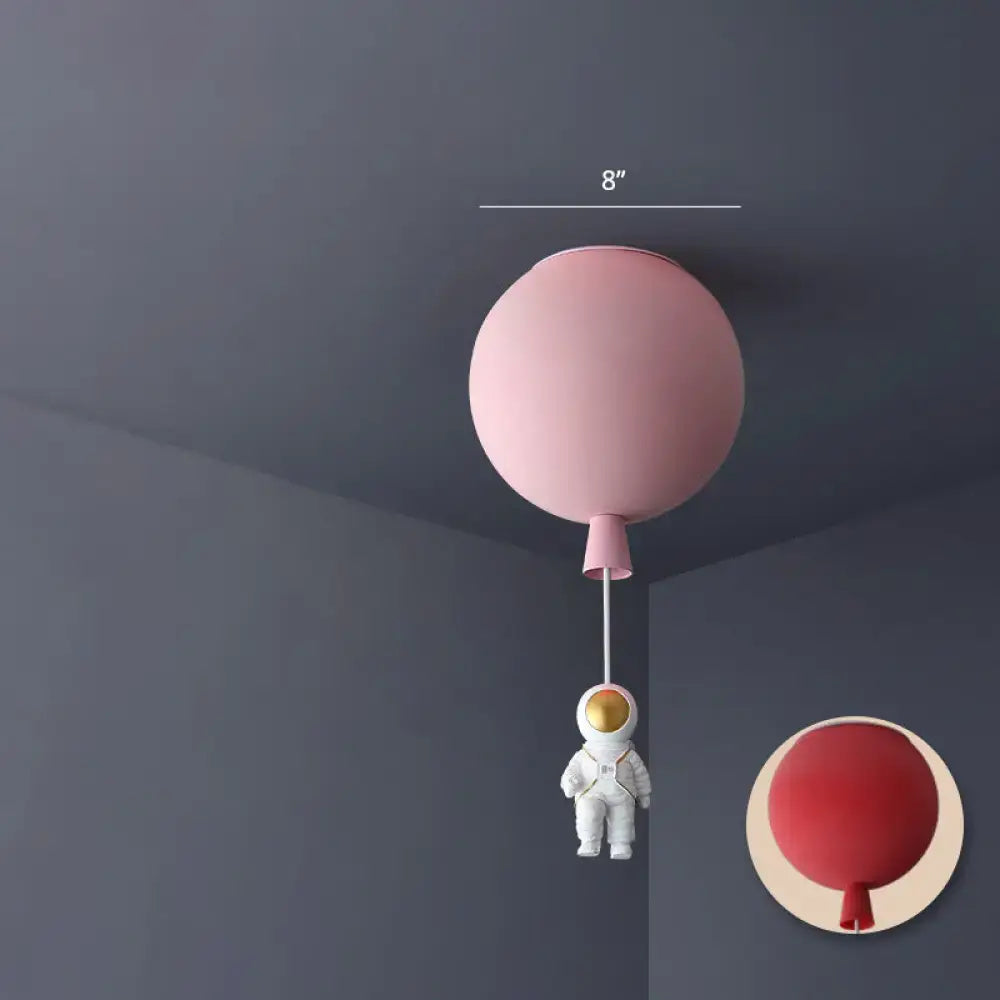 Pink astronaut ceiling lamp with balloon-shaped acrylic pendant light and white astronaut figurine for kids bedroom
