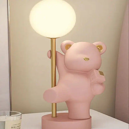 Pink bear princess desk night light featuring gold accents and a spherical frosted glass bulb for bedroom use