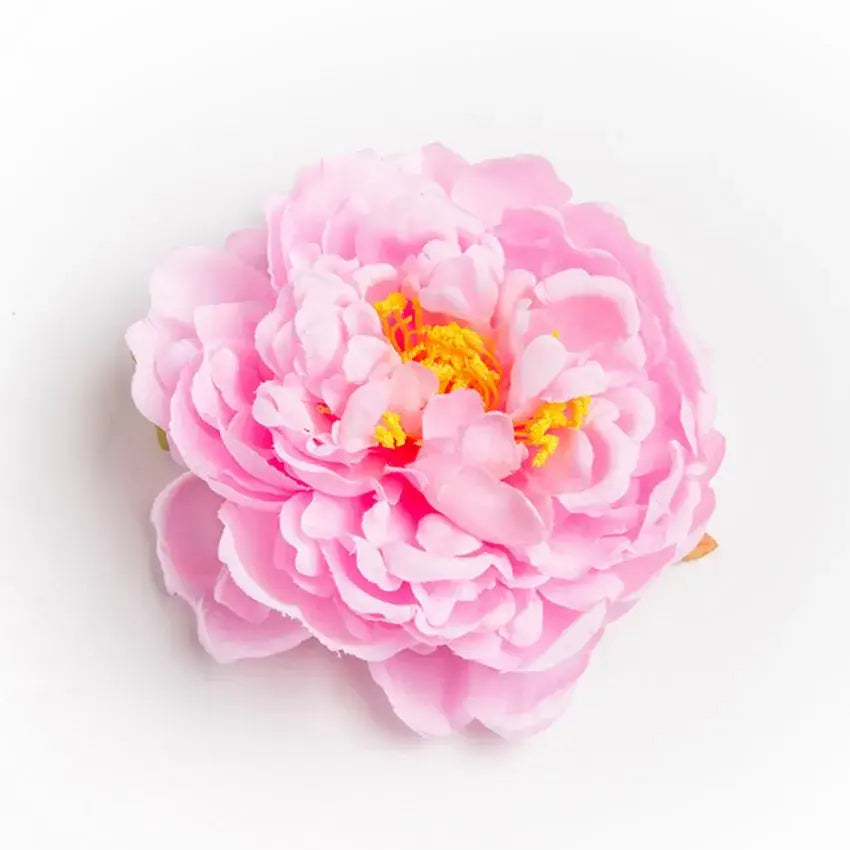 A delicate pink big peony headwear artificial flower with layered petals and a vibrant yellow center for wedding decoration