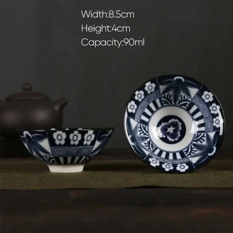 Blue and white porcelain hand-painted ceramic tea bowl with intricate floral and geometric patterns from decorbites