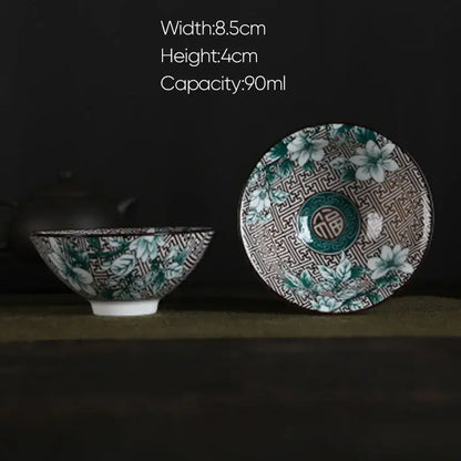 A white porcelain hand-painted ceramic bowl with green floral pattern and circular 福 emblem for decorbites blue dining set