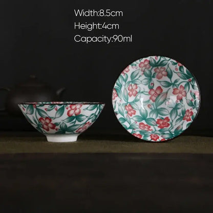 A white porcelain hand-painted bowl and saucer set featuring pink and black floral pattern for dining room decorbites blue