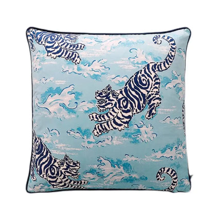 Light blue lumbar pillow cover with bold navy and white tiger illustrations and cloud pattern for bedroom decor featuring blue lion dog design