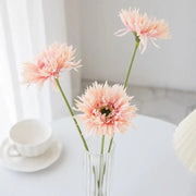 Pink brushed gerbera vase with three delicate artificial pink gerbera daisies in a clear ribbed glass vase for living room decor