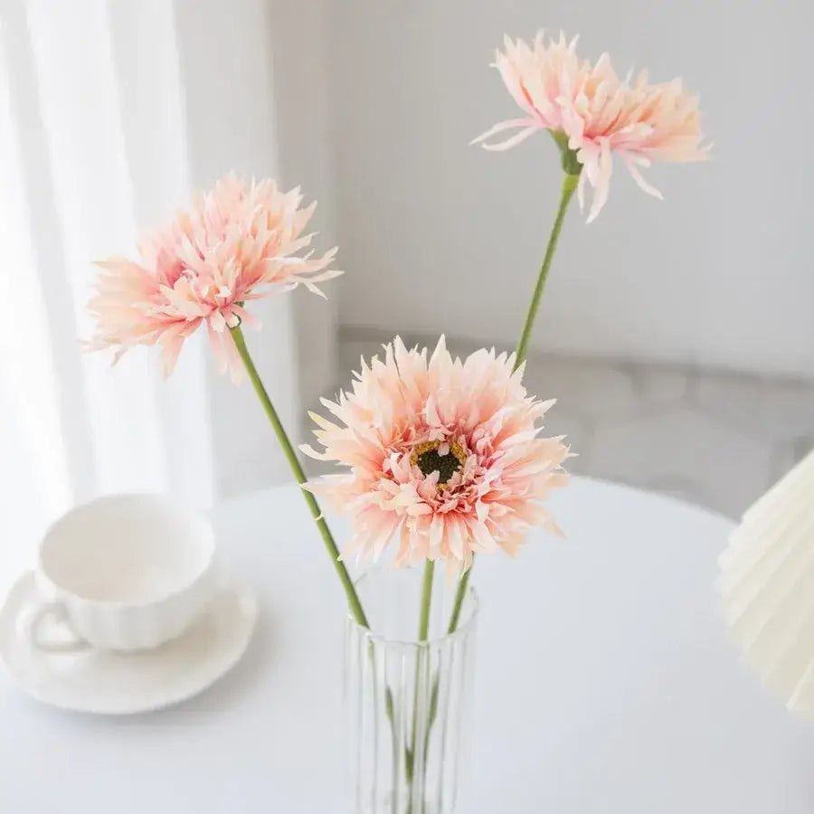 Pink brushed gerbera vase with three delicate artificial pink gerbera daisies in a clear ribbed glass vase for living room decor