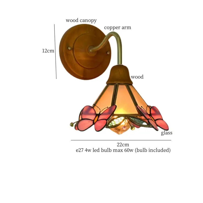 Pink butterfly glass led wall sconce with wooden canopy copper arm and warm amber pink decorbites glass led design