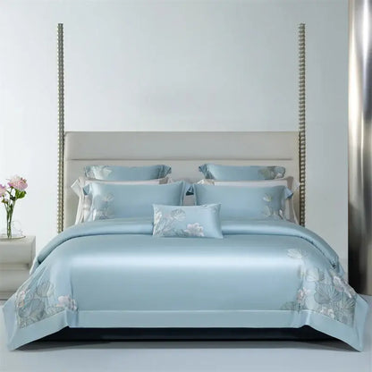 Light blue satin bedding set with soft white and pale pink decorbites cotton flowers embroidery design