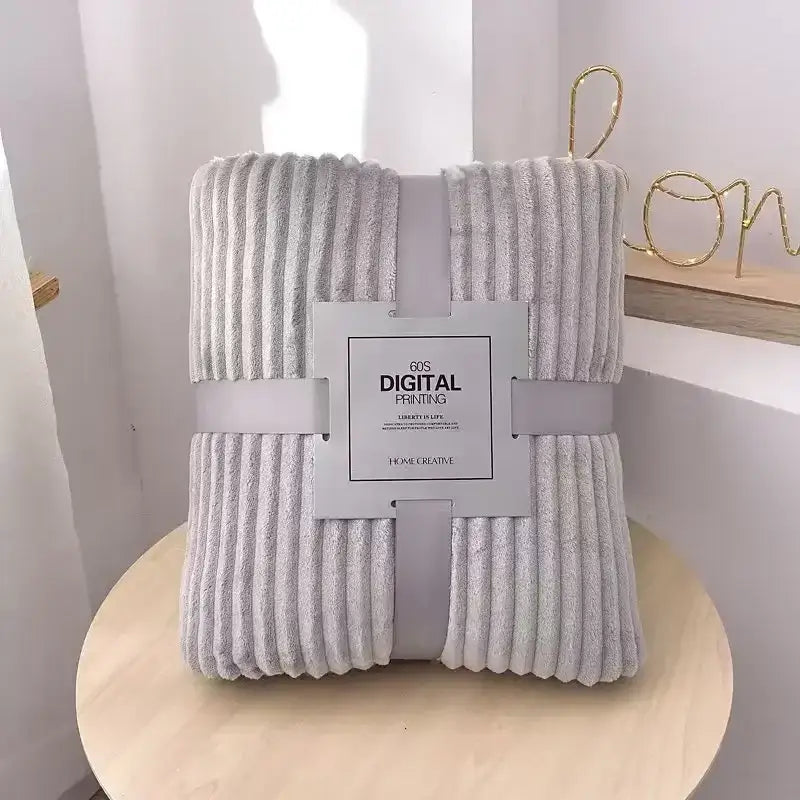 A soft light gray corduroy throw blanket with plush texture and vertical ribbed pattern for decorbites cozy striped decor