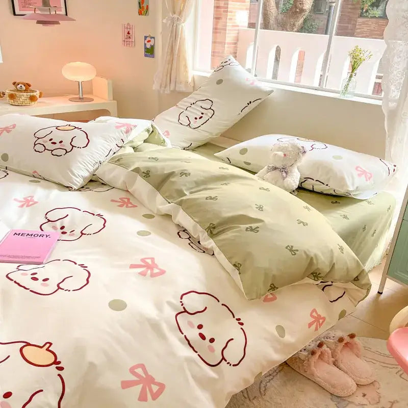 Cute pastel green and white cotton cartoon printed bed set featuring puppy faces and pink bows for bedroom decorbites