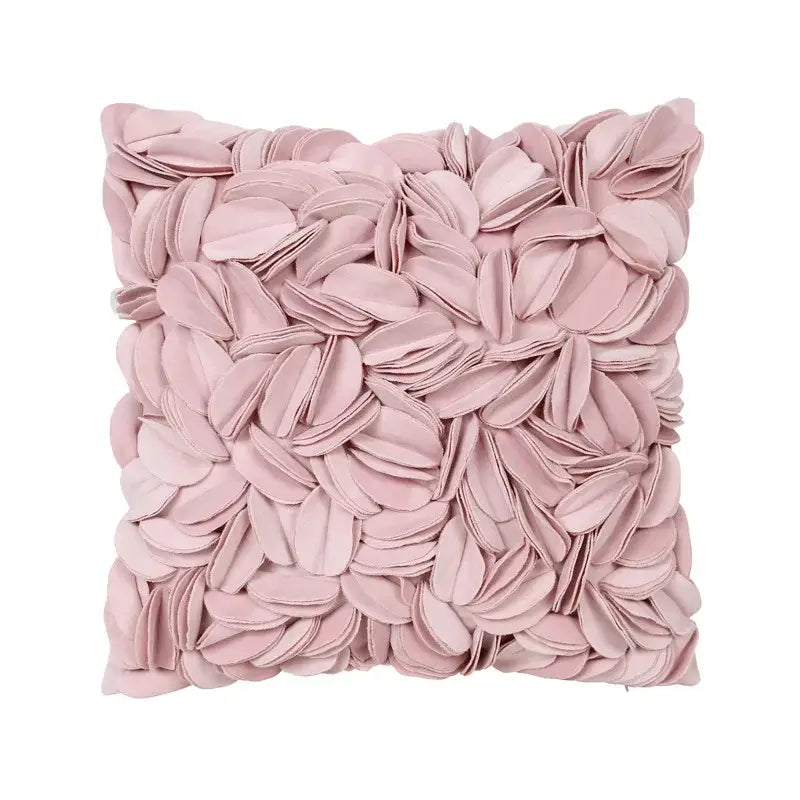 A soft blush pink plush pillowcase with a textured three-dimensional daisy sunflower floral design for decorbites