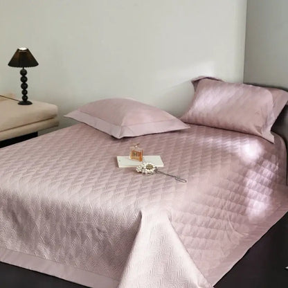 Soft pink diamond quilted cool lyocell fiber bedspread set with satin-like sheen for elegant bedroom decorbites use