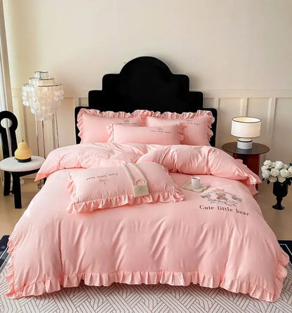 Pink embroidered bear cotton bed skirt set with ruffled design featuring a cute little bear for bedroom use