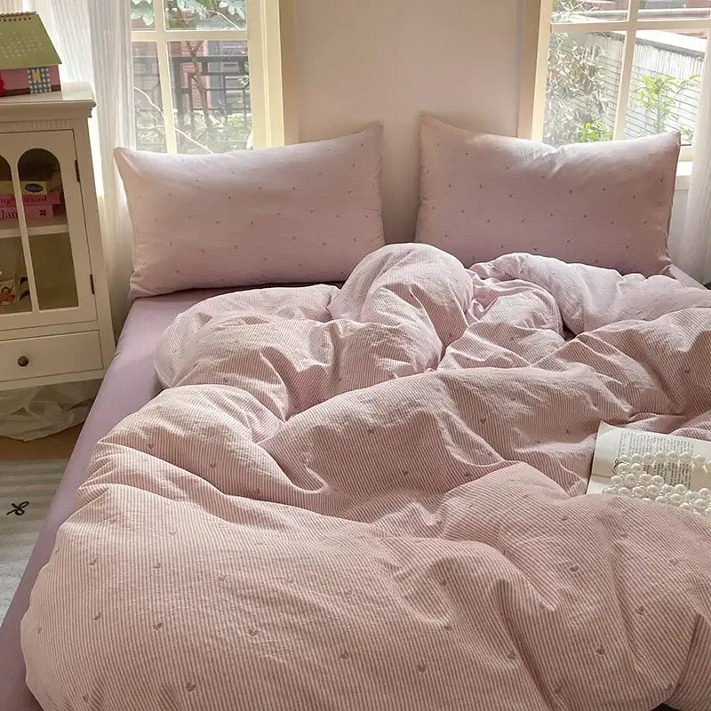 Pink floral double layer yarn bedspread set featuring a pink striped duvet with subtle dot pattern for bedroom bedding