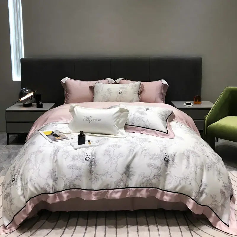 Pink and white satin duvet set with delicate gray floral embroidery and black piping from decorbites eucalyptus lyocell flowers collection
