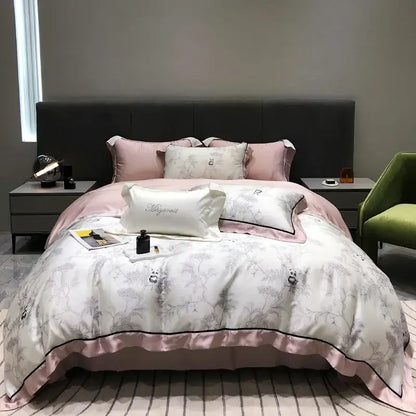 Pink and white satin duvet set with delicate gray floral embroidery and black piping from decorbites eucalyptus lyocell flowers collection
