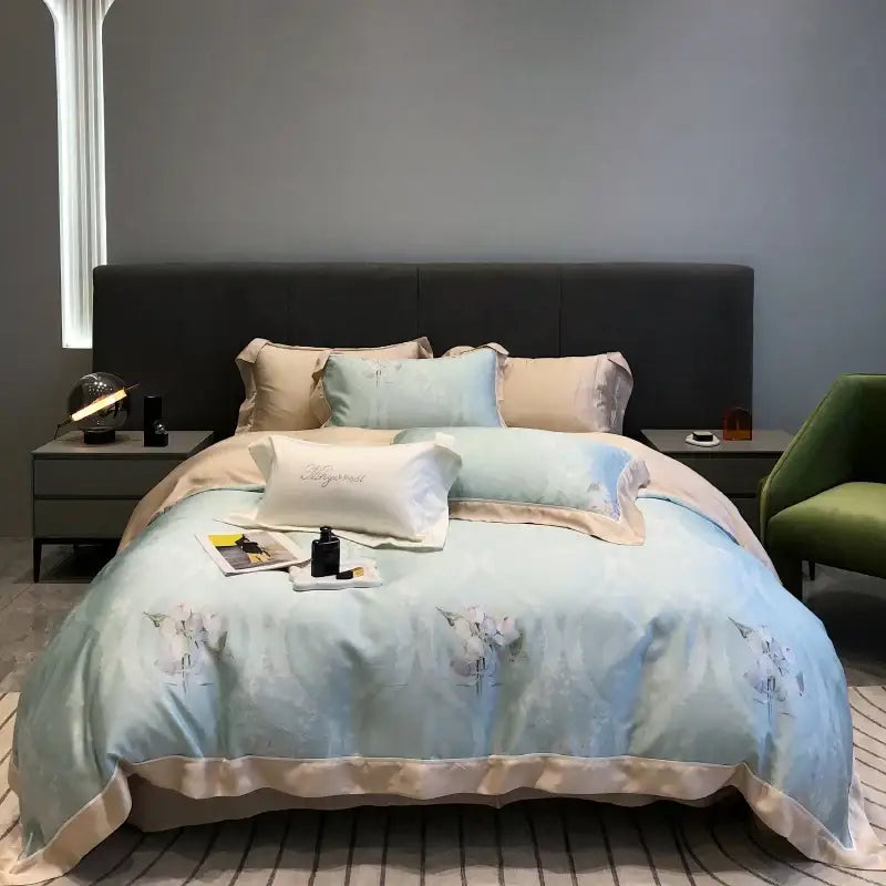 Light blue and beige floral patterned satin duvet set with embroidered pillowcase from decorbites eucalyptus lyocell flowers collection