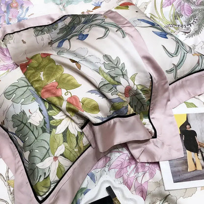 A delicate light pink satin pillow sham with eucalyptus lyocell flowers and green leaves from the duvet set