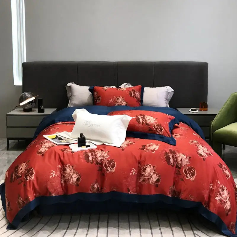 Red floral duvet set with navy blue trim and matching pillowcases made of decorbites eucalyptus lyocell flowers fabric