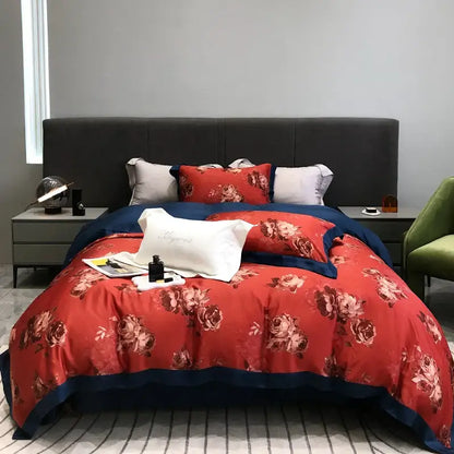 Red floral duvet set with navy blue trim and matching pillowcases made of decorbites eucalyptus lyocell flowers fabric