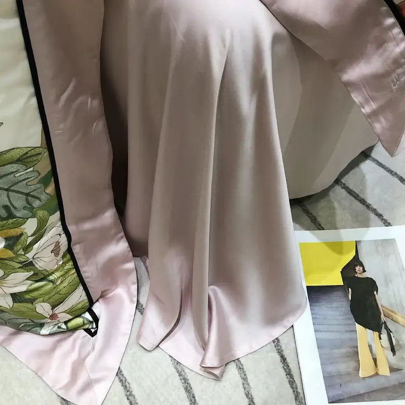 A soft blush-pink silk scarf with a delicate floral pattern complements the pink floral eucalyptus lyocell flowers duvet set