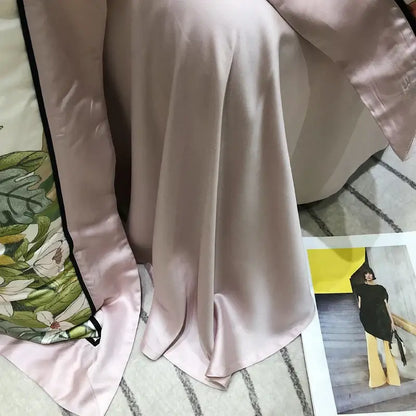 A soft blush-pink silk scarf with a delicate floral pattern complements the pink floral eucalyptus lyocell flowers duvet set