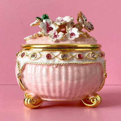 Pink porcelain jewelry trinket box with gold accents floral butterfly embellishments and gemstone storage case