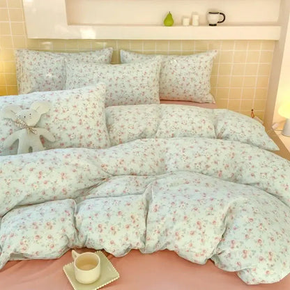 Pastel blue floral fitted sheet set with pink and green blossoms on soft cotton fabric for bedroom comfort