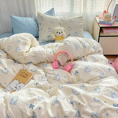 Cream-colored cotton comforter set with cozy cartoon printed blue bunnies and bows for decorbites bedroom decor