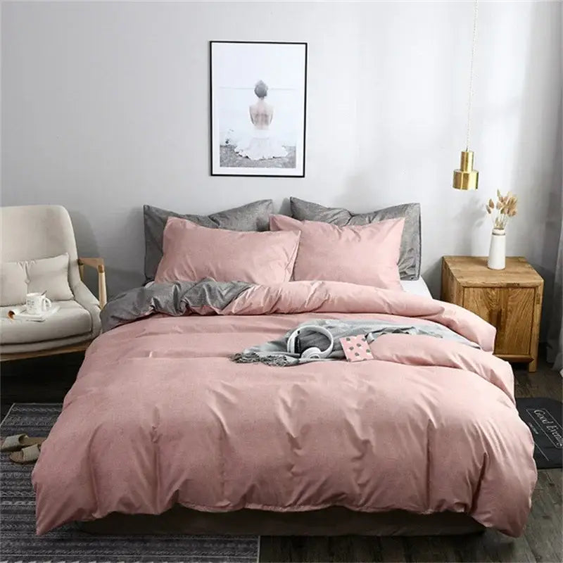 Pink and gray duvet cover set made of soft plush fabric with a throw blanket for bedroom bedding use