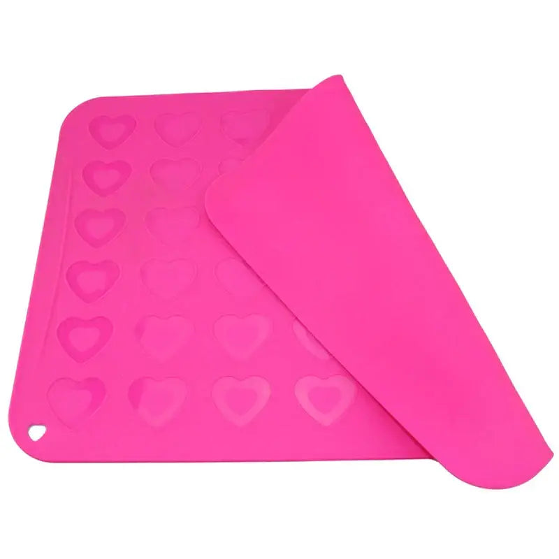Bright pink decorbites silicone macaron baking mat with heart-shaped molds for macaron baking and cookies
