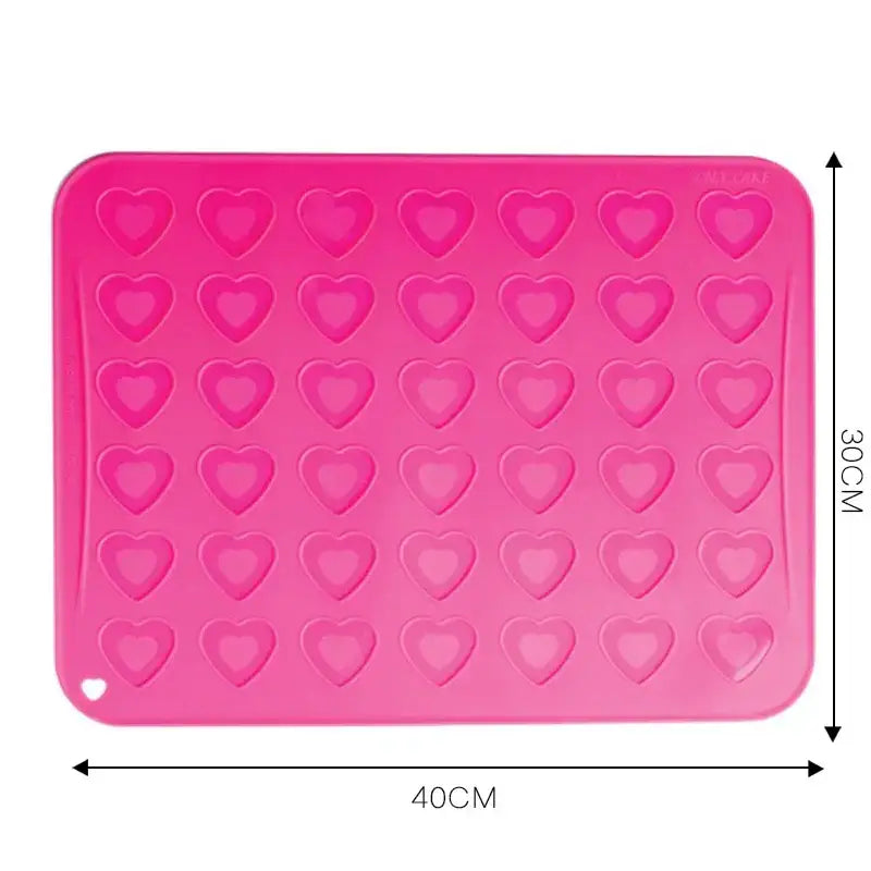 Pink heart silicone macaron baking mat with heart-shaped molds from decorbites for precise macaron baking