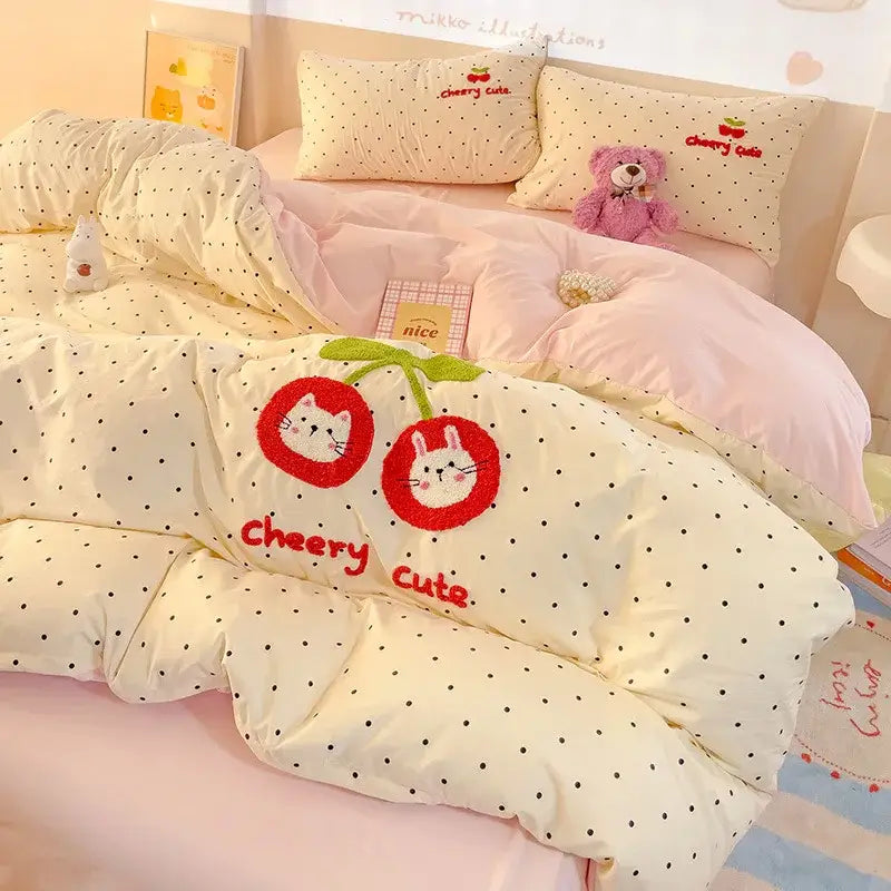 Cream-colored quilt bedding set with black polka dots embroidered red cherries and white cat faces in decorbites cloud cotton