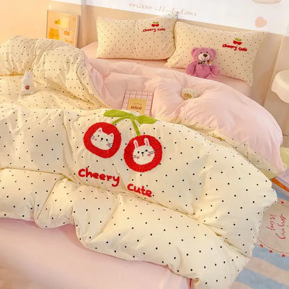 Cream-colored quilt bedding set with black polka dots embroidered red cherries and white cat faces in decorbites cloud cotton