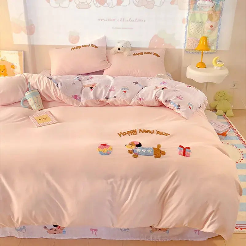Pink new year dog cotton bedding set featuring happy new year embroidery with cartoon dog cupcake and gift box design