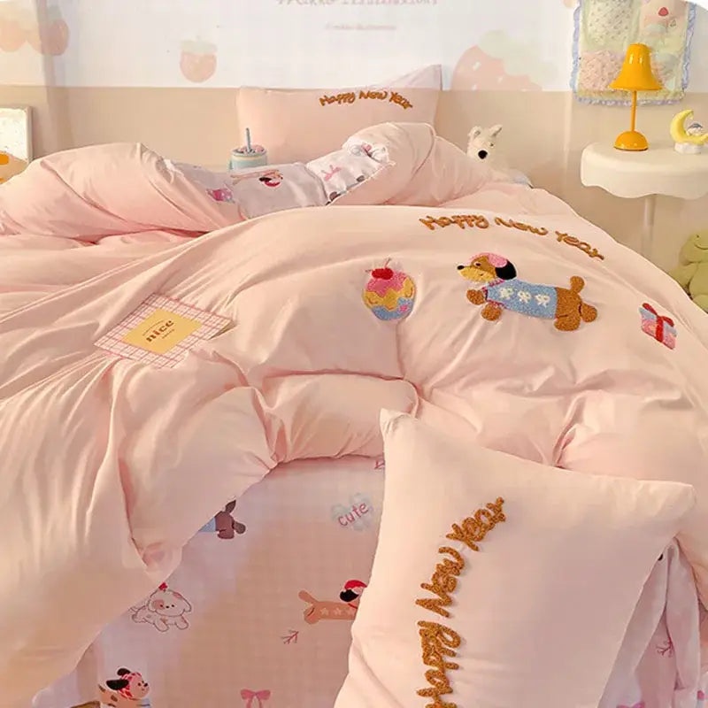 Pink quilted cotton bedding set with happy new year embroidery and dog ice cream gift motifs from decorbites