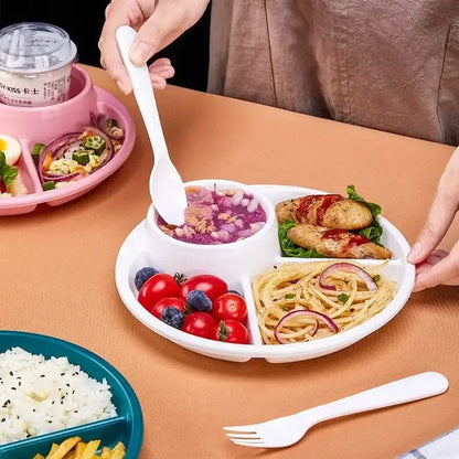 White plastic portion control plate with compartments for soup pasta chicken and vegetables for kids meal tray